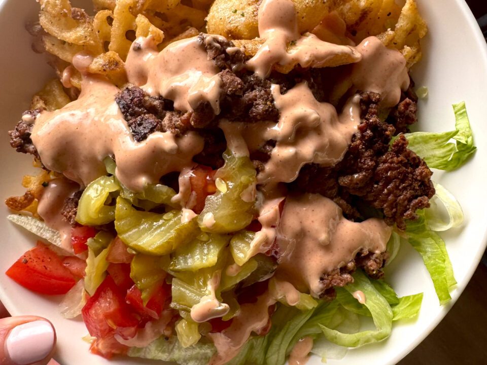 Burger bowl with house sauce on top.