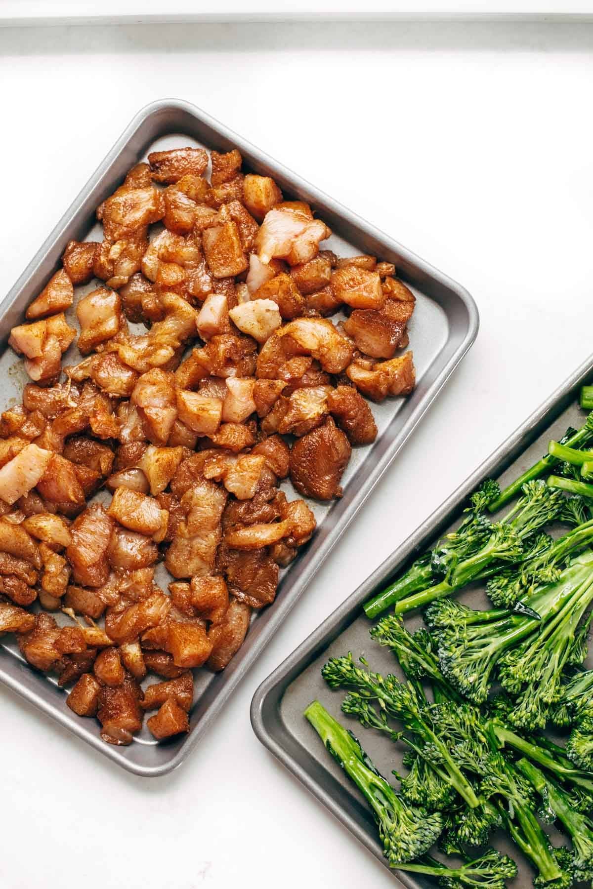 Chicken and broccolini on sheet pans.
