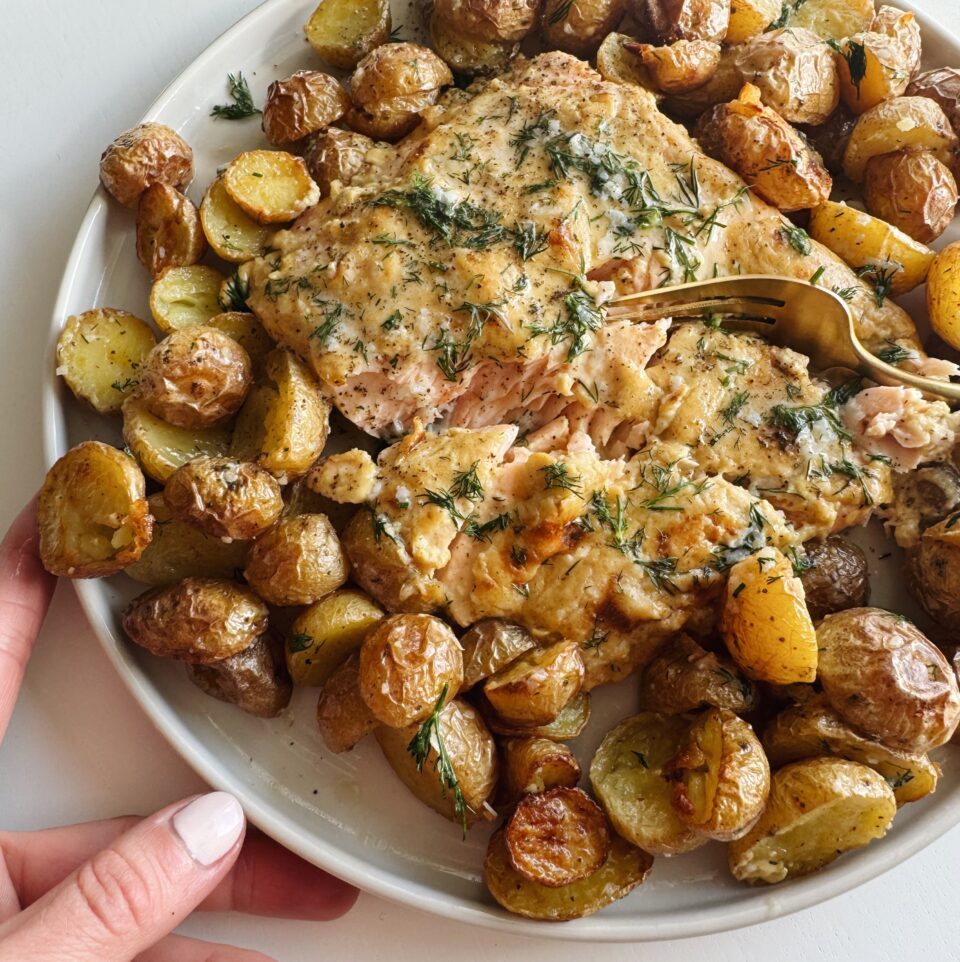 Salmon on a plate with potatoes.