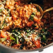 Stewed farro and veggies in a large pot.