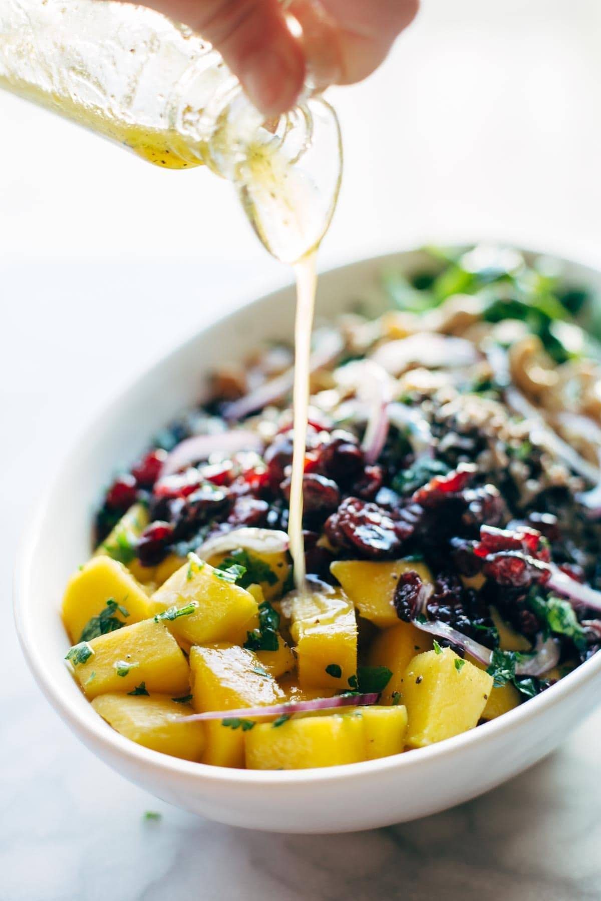 Easy Thanksgiving Salad - arugula, wild rice, cashews, dried cranberries, red onions, and a lemon dressing that shakes up easily in a jar. | pinchofyum.com Easy Thanksgiving Salad - arugula, wild rice, cashews, dried cranberries, red onions, and a lemon dressing that shakes up easily in a jar. | pinchofyum.com
