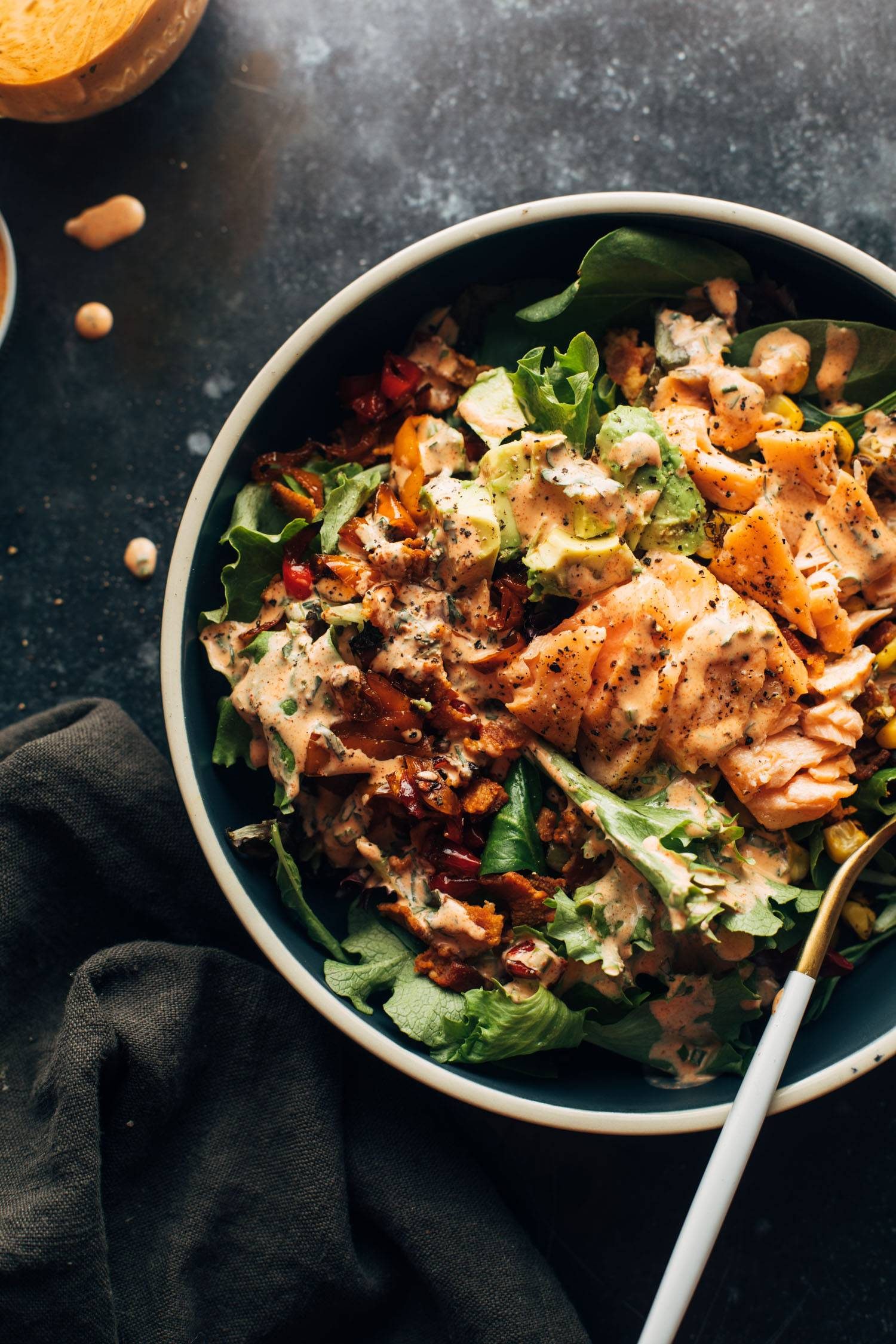 Salmon salad in a bowl with a fork