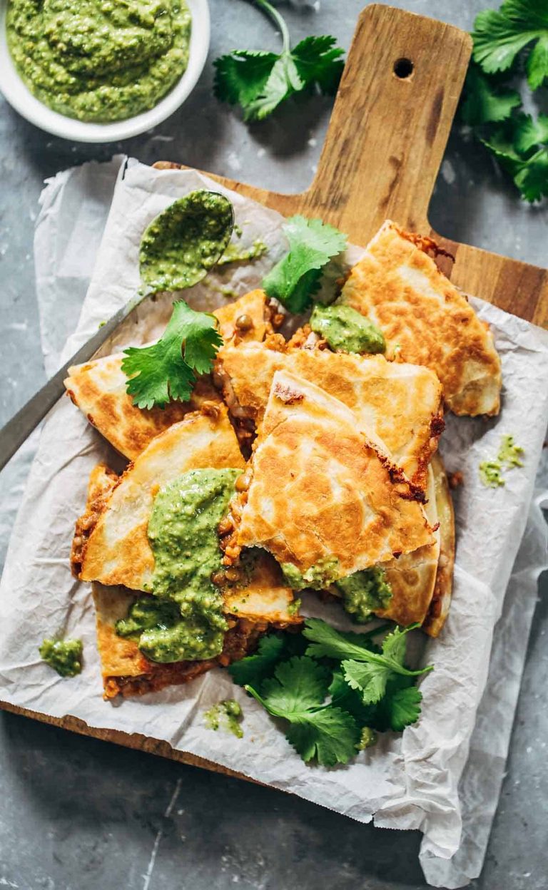Lentil quesadillas on a cutting board.