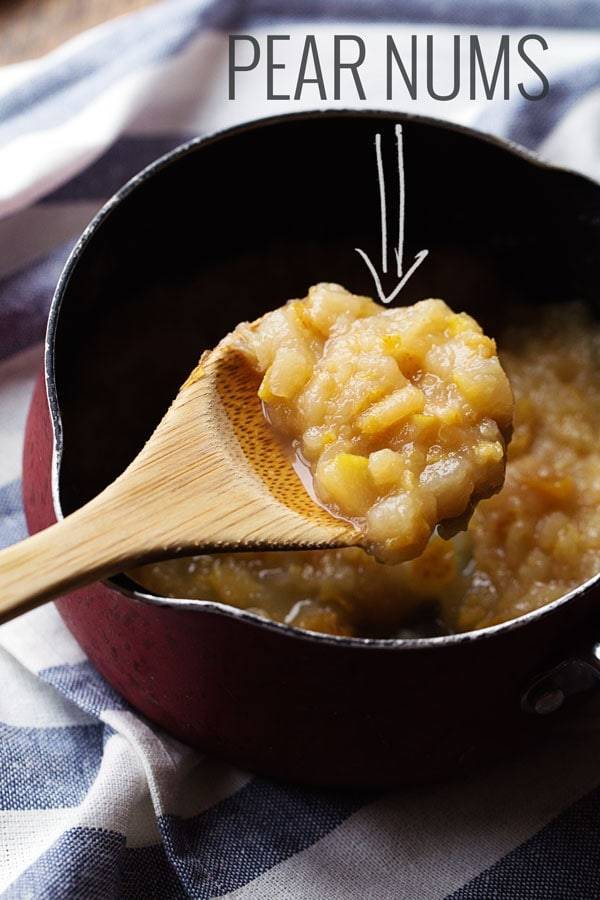 Pears on a wooden spoon.