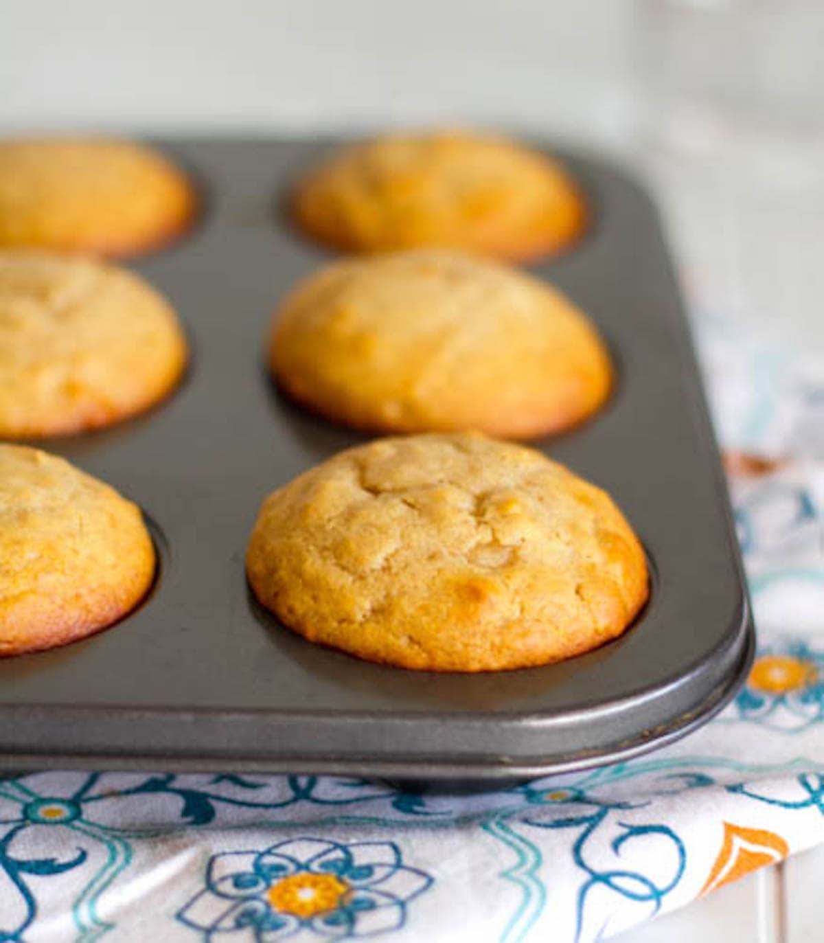 Peanut butter and honey muffins in a tin.